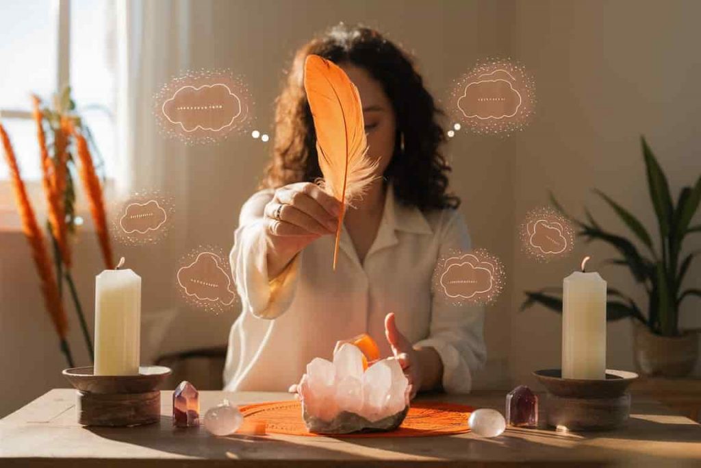Person performing a spiritual ritual with orange feathers on an altar, surrounded by manifestation symbols