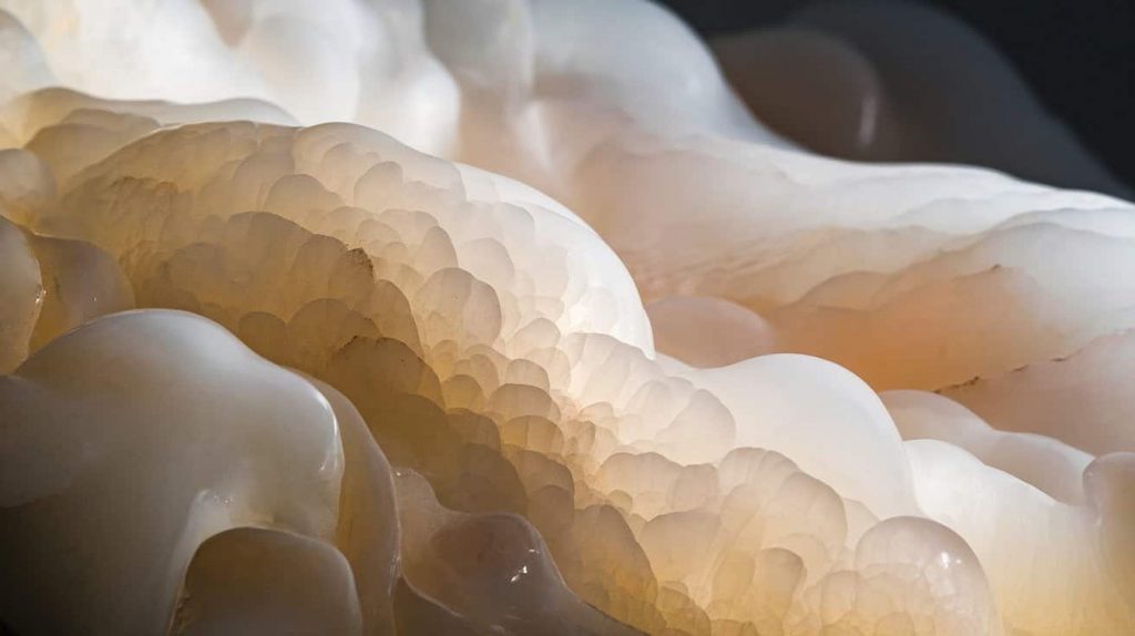 Close-up of white jade's smooth, milky surface showing its unique texture and translucent qualities