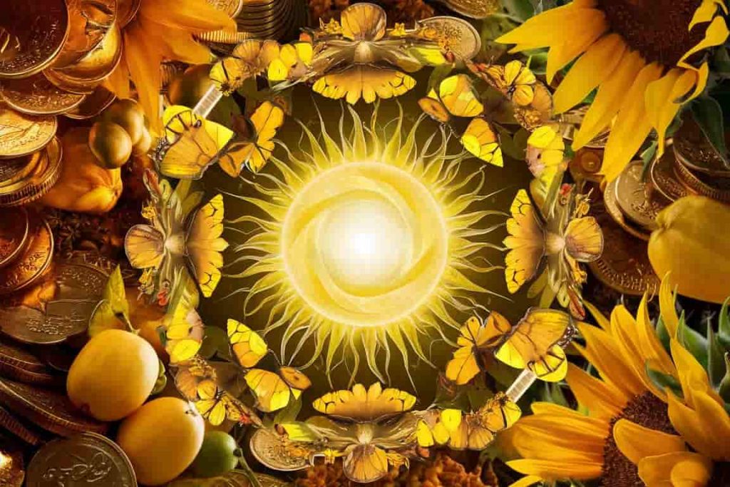 Circular collage of yellow dream objects including sun, coins, fruits, flowers, and butterflies
